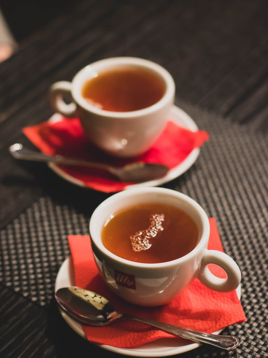 cup tea with saucer and teaspoon