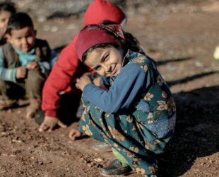 children playing outside in the mud