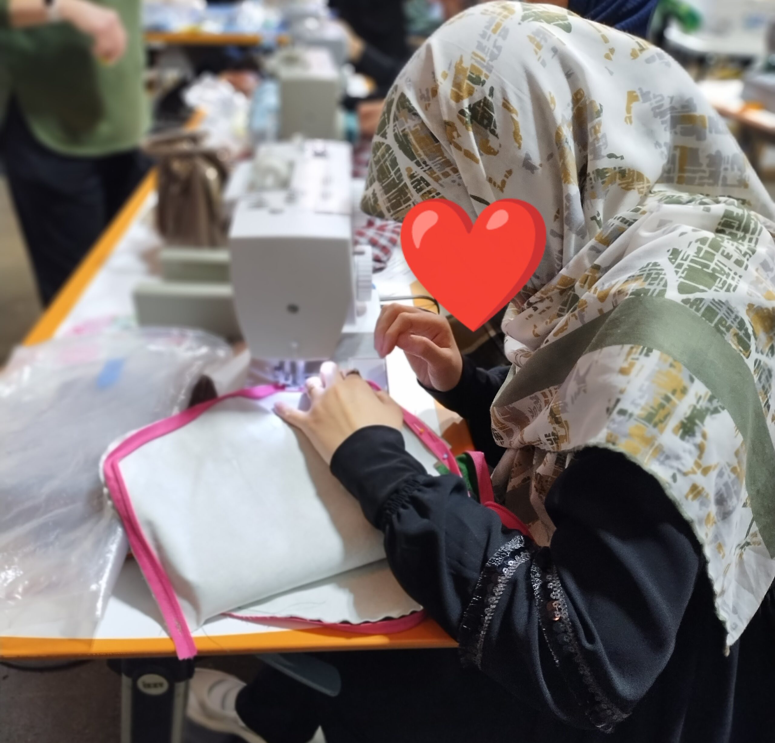 Refugee woman sewing bag in Charlotte North Carolina