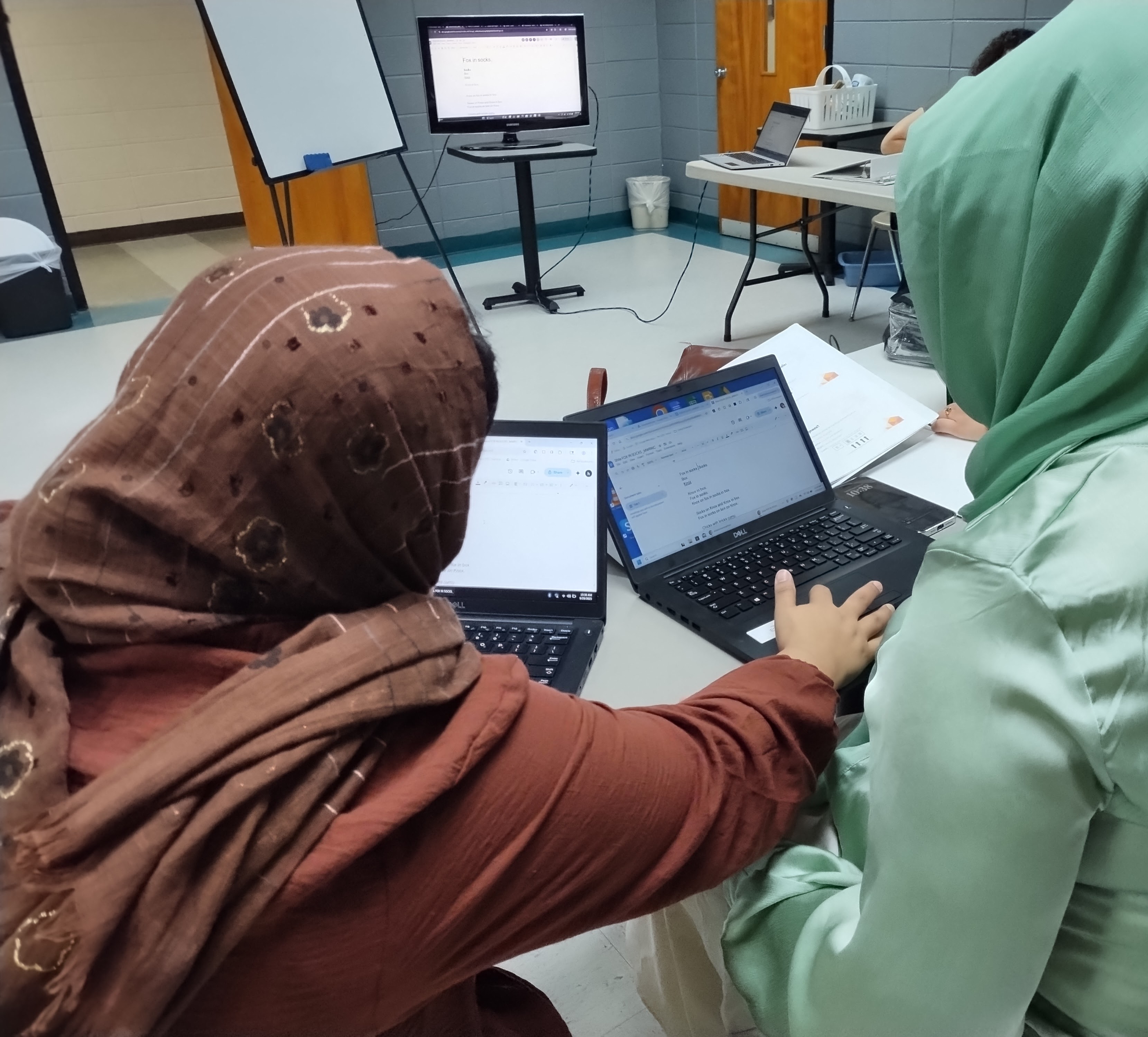 Afghan women learning computer skills in Charlotte, NC